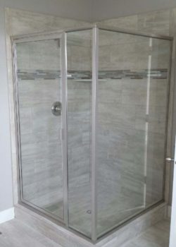 Framed shower enclosure